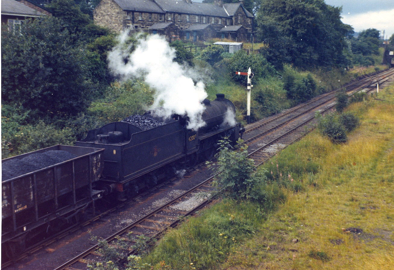 K1s did not regularly appear on the Tyne Dock - Consett line until the last year or so of steam. Here, K1 62007 is checked by the signal short of Beamish station. If trains ahead were making slow progress, or had stopped for a blow up then trains in the following section were immediately affected. Stopping at Beamish was very common. Above the loco can be seen 'Station Cottages', railwaymen's dwellings and the only thing that now remain. Photo copyright David Milburn